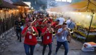 Musicians play their instruments during the annual brass band festival in Guca, Serbia, on August 13, 2021. Reuters/Zorana Jevtic