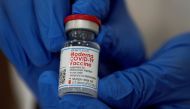 An employee shows the Moderna COVID-19 vaccine at Northwell Health's Long Island Jewish Valley Stream hospital in New York, U.S., December 21, 2020. REUTERS/Eduardo Munoz/File Photo