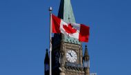 FILE PHOTO: A Canadian flag flies in front of the Peace Tower on Parliament Hill in Ottawa, Ontario, Canada, March 22, 2017. REUTERS/Chris Wattie/File Photo/File Photo
