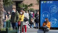 People queue outside the biggest coronavirus disease (Covid-19) vaccination centre in Brussels, Belgium March 3, 2021. Reuters/Yves Herman