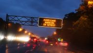 Signs on the highway warn commuters not to travel on Sunday as Hurricane Henri approaches in Long Island, New York, U.S., August 21, 2021. REUTERS/Caitlin Ochs