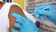 A Somali healthcare worker receives a vaccine against coronavirus disease (COVID-19) pandemic in Mogadishu, Somalia August 21, 2021 Reuters/Feisal Omar