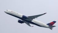 FILE PHOTO: A Delta Air Lines Airbus A350-900 plane takes off from Sydney Airport in Sydney, Australia, October 28, 2020. REUTERS/Loren Elliott/File Photo
