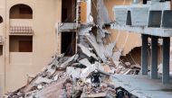 Firefighters work among the debris of a collapsed building in the town of Peniscola, Spain, August 26, 2021. REUTERS/Eva Manez NO RESALES. NO ARCHIVES