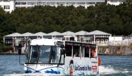 An amphibious bus named Marcel le Canard (Marcel The Duck) sails down the Seine river during a tour around Paris, in Sevres near Paris, France, August 25, 2021. Picture taken August 25, 2021. REUTERS/Sarah Meyssonnier