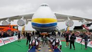 Ukrainian strongman athletes attempt to set a world record for pulling the world's largest cargo plane Antonov An-225 Mriya at an airfield in the settlement of Hostomel outside Kyiv, Ukraine August 26, 2021. REUTERS/Gleb Garanich
