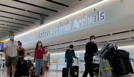 FILE PHOTO: Passengers from international flights arrive at Heathrow Airport, following the outbreak of the coronavirus disease (COVID-19), London, Britain, July 29, 2020. REUTERS/Toby Melville
