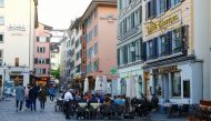 Guests sit outside of a restaurant, as the spread of the coronavirus disease (COVID-19) continues, in the old town of Zurich, May 22, 2021. Picture taken May 22, 2021. REUTERS/Arnd Wiegmann