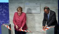 Tedros Adhanom Ghebreyesus (R), Director-General of the World Health Organization (WHO), and German Chancellor Angela Merkel attend the inauguration ceremony of the 'WHO Hub For Pandemic And Epidemic Intelligence' at the Langenbeck-Virchow building in Ber