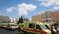 Ambulances are seen outside the parliament building during a protest over mandatory vaccinations and the indefinite suspension for those working in the health care sector that have not had at least one shot of the vaccine, in Athens, Greece September 2, 2