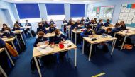 Students attend a lesson at Weaverham High School, as the coronavirus disease (COVID-19) lockdown begins to ease, in Cheshire, Britain, March 9, 2021. REUTERS/Jason Cairnduff/File Photo
