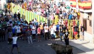 Revellers and spectators watch a steer during the first running-of-the-bull festival since the coronavirus disease (COVID-19) pandemic began in Villaseca de la Sagra, central Spain, September 5, 2021. Reuters/Sergio Perez