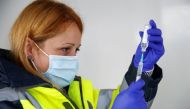 Lead Pharmacist Alina Barbu prepares a dose of Pfizer vaccine against COVID-19 at a vaccination centre in Pharmacy 4 U, amid the outbreak of the coronavirus disease (COVID-19), in Blackburn, Britain, May 19, 2021. REUTERS/Jason Cairnduff
