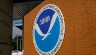 FILE PHOTO: The logo of the National Oceanic and Atmospheric Administration is seen at the National Hurricane Center in Miami, Florida, U.S. August 29, 2019. REUTERS/Marco Bello/File Photo

