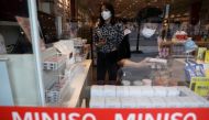 Customers shop at a store of Chinese retailer MINISO Group in Beijing, China September 13, 2021. REUTERS/Tingshu Wang