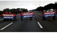 Members of Insulate Britain protest on M25 Motorway, Britain September 15, 2021, in this still image taken from a handout video. Insulate Britain/Handout via Reuters