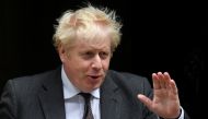 Britain's Prime Minister Boris Johnson gestures as he walks outside Downing Street in London, Britain, September 15, 2021. REUTERS/Toby Melville