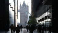Workers walk towards Tower Bridge during the morning rush hour, amid a relaxation of lockdown restrictions during the coronavirus disease (COVID-19) pandemic in London, Britain, September 15, 2021. REUTERS/Toby Melville