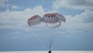 The quartet of newly minted citizen astronauts comprising the SpaceX Inspiration4 mission safely splashes down in SpaceX's Crew Dragon capsule off the coast of Kennedy Space Center, Florida, U.S. September 18, 2021. SpaceX/Handout via REUTERS