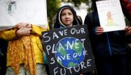 File photo: A child carries a sign during an Extinction Rebellion demonstration in London, Britain, October 12, 2019. Reuters/Henry Nicholls/File Photo