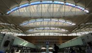FILE PHOTO: A view of a handful of travellers, many in protective masks amid coronavirus disease (COVID-19) outbreak, at the departures hall of the San Francisco International Airport in San Francisco, U.S., March 20, 2020. REUTERS/Stephen Nellis
