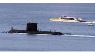 File photo: A Rivercat ferry passes by the Royal Australian Navy's Collins-class submarine HMAS Waller as it leaves Sydney Harbour on May 4, 2020. 