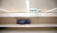 Empty shelves are seen in the soft drinks aisle of Sainsbury's supermarket, Harpenden, Britain, September 22, 2021. REUTERS/Peter Cziborra