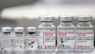 Vials of coronavirus disease (COVID-19) vaccines of Pfizer-BioNTech and Moderna are seen in the town of Ricany near Prague, Czech Republic, February 25, 2021. REUTERS/David W Cerny/File Photo/File Photo