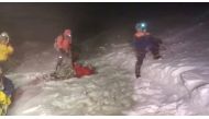 Members of Russia's Emergencies Ministry conduct a rescue operation after a group of climbers got stuck while climbing Mount Elbrus, in the Republic of Kabardino-Balkaria, Russia, in this still image from video taken September 23, 2021. Video taken Septem