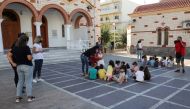 Students and their teachers are seen at a square following an earthquake in Heraklion, on the island of Crete, Greece, September 27, 2021. REUTERS/Stefanos Rapanis