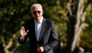 U.S. President Joe Biden walks from Marine One as he returns from Camp David to the White House in Washington, U.S., September 26, 2021. REUTERS/Joshua Roberts
