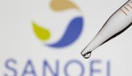 A test tube is seen in front of a displayed Sanofi logo in this illustration taken September 8, 2021. REUTERS/Dado Ruvic/Illustration/File Photo