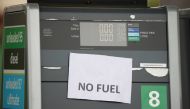 A 'No Fuel' sign is attached to an empty petrol pump at a BP filling station in Manchester, Britain, September 28, 2021. Reuters/Phil Noble