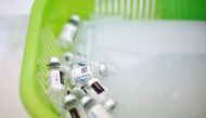 Empty vials of the Janssen vaccine against the coronavirus disease (COVID-19) are seen in a basket at a Mi Teleferico cable car station turned into a vaccination centre, in El Alto, Bolivia July 25, 2021. REUTERS/Manuel Claure