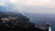 Lava flows into the sea, as seen from Tijarafe, following the eruption of a volcano on the Canary Island of La Palma, Spain, September 29, 2021. REUTERS/Borja Suarez
