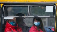People wear protective face masks sit in a bus amid the ongoing coronavirus disease (COVID-19) outbreak in central Kyiv, Ukraine September 29, 2021. REUTERS/Gleb Garanich
