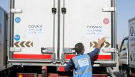 A man checks a vehicle containing a shipment of the AstraZeneca vaccine against the coronavirus disease (COVID-19) at Baghdad International Airport, in Baghdad, Iraq March 25, 2021. REUTERS/Khalid al-Mousily