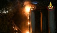 A fire engulfs iconic 'Iron Bridge' in Rome, Italy, October 3, 2021. Vigili del Fuoco/Handout via REUTERS