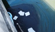 Oil slicks make their way into the Talbert Channel after a major oil spill off the coast of California has come ashore in Huntington Beach, California, U.S. October 3, 2021. REUTERS/Gene Blevins