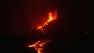 The Cumbre Vieja volcano continues to erupt on the Canary Island of La Palma, as seeen from the sea, Spain, October 3, 2021. REUTERS/Juan Medina
