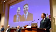 Thomas Perlmann, Secretary of the Nobel Assembly and the Nobel Committee, announces the winners of the 2021 Nobel Prize in Physiology or Medicine David Julius and Ardem Patapoutian (seen on the screen) during a press conference at the Karolinska Institute