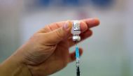 A health worker prepares a dose of the COVID-19 booster vaccine, amid the coronavirus disease (COVID-19) pandemic, at Midland House in Derby, Britain, September 20, 2021. REUTERS/Carl Recine