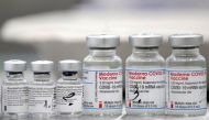 Vials of coronavirus disease (COVID-19) vaccines of Pfizer-BioNTech and Moderna are seen in the town of Ricany near Prague, Czech Republic, February 25, 2021. REUTERS/David W Cerny/File Photo
