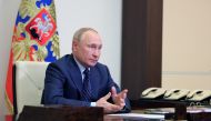 Russian President Vladimir Putin attends a meeting with members of the Security Council via a video link at his residence outside Moscow, Russia October 11, 2021. Sputnik/Evgeniy Paulin/Kremlin via REUTERS
