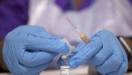 FILE PHOTO: A medical worker prepares an injection with a dose of Astra Zeneca coronavirus vaccine, at a vaccination centre in Baitul Futuh Mosque, amid the outbreak of coronavirus disease (COVID-19), in London, Britain, March 28, 2021. REUTERS/Henry Nich
