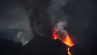 The Cumbre Vieja volcano spews lava and smoke as it continues to erupt on the Canary Island of La Palma, as seen from Tacande, Spain, October 12, 2021. REUTERS/Sergio Perez