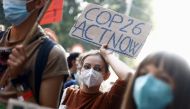 People take part in the 'Global march for climate justice' while environment ministers meet ahead of Glasgow's COP26 meeting, in Milan, Italy, October 2, 2021. Reuters/Guglielmo Mangiapane/File Photo