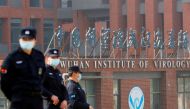 FILE PHOTO: Security personnel keep watch outside Wuhan Institute of Virology during the visit by the World Health Organization (WHO) team tasked with investigating the origins of the coronavirus disease (COVID-19), in Wuhan, Hubei province, China Februar