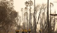 Firefighters extinguish hot spots from the Alisal fire near Refugio State Beach in Santa Barbara County, California, U.S., October 13, 2021. Picture taken October 13, 2021. REUTERS/Aude Guerrucci