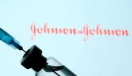 A vial and syringe are seen in front of a displayed Johnson & Johnson logo in this illustration taken January 11, 2021. REUTERS/Dado Ruvic/Illustration/File Photo
